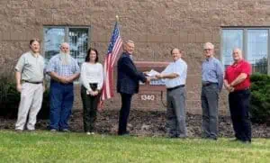 Team photo in front of the Valv-Trol office building